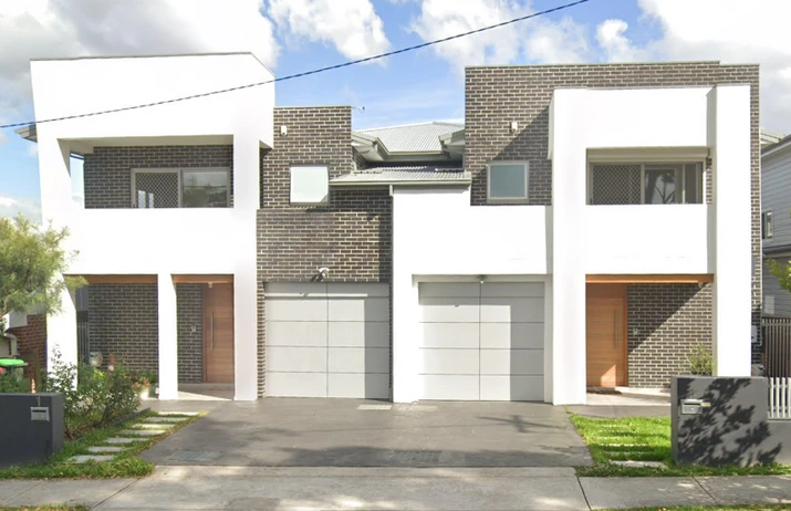 The two residences at Scott Street, Mortdale, with brick and white façades